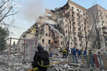 Emergency crews operate outside a heavily damaged nine-story residential building after a direct hit destroyed multiple floors. (Source: State Emergency Service of Ukraine)