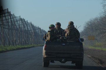 Ukraine Aims to Inflict 200 Russian Casualties for Every Sq Km of Advance, Fedorov Says Ukrainian soldiers ride in a pickup trailer. (Source: Getty Images)