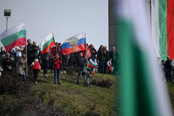 People wave Bulgarian and Russian flags at the Defenders of Stara Zagora memorial Complex during a commemoration marking Bulgaria’s Liberation Day in Stara Zagora on March 3, 2026. (Source: Getty Images)