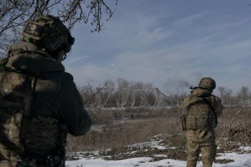Anti-drone netting covers a supply route near Kostyantynivka in Ukraine’s Donetsk region, February 2026. Burned military vehicles are seen along the road amid ongoing Russian drone attacks. (Source: Getty Images) Anti-drone netting covers a supply route near Kostyantynivka in Ukraine’s Donetsk region, February 2026. Burned military vehicles are seen along the road amid ongoing Russian drone attacks. (Source: Getty Images)