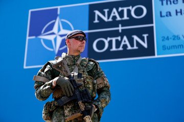 Europe and Canada Boost Defense Spending by 19% in 2025 Amid Rising Security Threats A soldier on patrol ahead of the North Atlantic Treaty Organization summit in The Hague, Netherlands, on Monday, June 23, 2025. Illustrative photo. (Source: Getty Images)