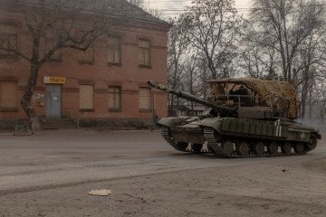 A Ukrainian tank drives on a road in a village in the Dnipropetrovsk region, on March 16, 2025.
