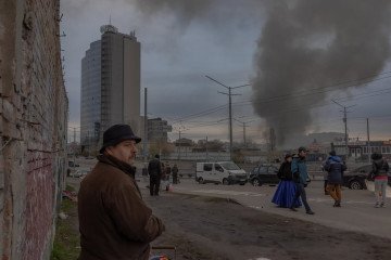 Smoke rises following a Russian strike, as residents observe the aftermath. (Source: Roman Pilipey/Instagram)