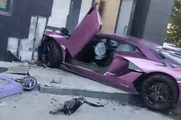 Purple Lamborghini registered to Russian oligarch Igor Altushkin sits crashed into a building entrance in Yekaterinburg, Russia. (Source: Russian media)