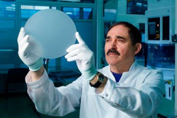 Vladimir Polyakov, founder and owner of the Energomera Group, which includes Monocrystal, holding a factory product.