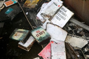 60,000 Books Destroyed as Russian Drone Hits Warehouse Serving Ukrainian Publishers Copies of charred books lie among retail stalls. (Source: Getty Images)