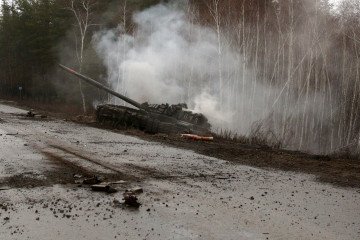 Smoke rises from a Russian tank destroyed by the Ukrainian forces on the side of a road in the Lugansk region on February 26, 2022. (Source: Getty Images) Smoke rises from a Russian tank destroyed by the Ukrainian forces on the side of a road in the Lugansk region on February 26, 2022. (Source: Getty Images)
