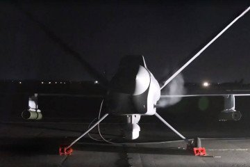 Rear view of Russia’s Orion UAV on a night airstrip, armed with Kh-BPLA guided missiles under each wing. (Source: Defence Blog)