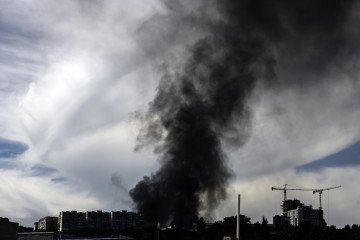 Black smoke is rising in the sky over the city after a Russian missile strike. (Source: Getty Images)