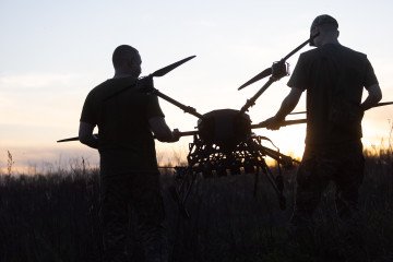 Ukrainian soldiers of the 127th Heavy Mechanized Brigade prepare a Heavy Shot bomber drone for launch in the Kharkiv region, May 2026. (Source: Getty Images)