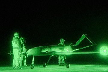 Ukrainian servicemen prepare a long-range strike drone for a nighttime mission. (Source: Ukrainian Defense Ministry)