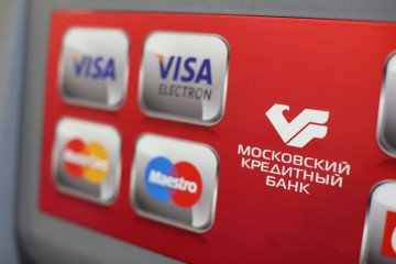 Logos for Visa Inc., Maestro and Mastercard Inc. payment systems sit on an automated teller machine used by a customer inside a Credit Bank of Moscow bank branch in Moscow, Russia, April 22, 2014. Illustrative image. (Photo: Getty Images)