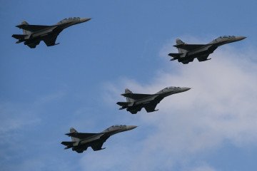 Russian-made Venezuelan Air Force Sukhoi Su-30MKV multirole strike fighters overfly a military parade on July 5, 2022. Illustrative photo. (Source: Getty Images)