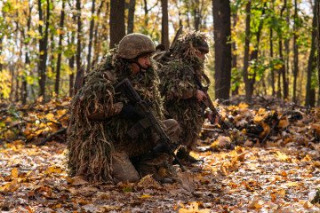 Recruits of the 13th Brigade of the National Guard of Ukraine undergo field training alongside specialized drone operators near Kharkiv, Ukraine, on October 21, 2026.
