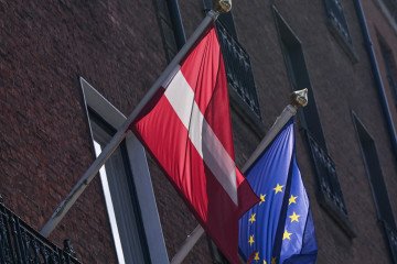 Latvia Imposes National Sanctions on Usmanov and Fridman After EU Removal The national flag of Latvia flies beside the European Union flag. (Source: Getty Images)