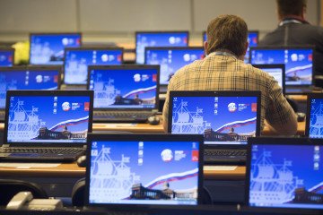 Journalists work at computer terminals in the media conference center in St. Petersburg, Russia, on Wednesday, June 19, 2013. Illustrative photo.