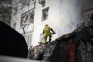 Firefighter at the site of a Russian drone attack on a civilian high-rise in Chernihiv, August 24, 2026.