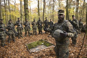 Recruits attend a tank destruction exercise in the field at the Westfalen-Kaserne barracks of the German armed forces in Ahlen, western Germany, on November 13, 2025. (Source: Getty Images)