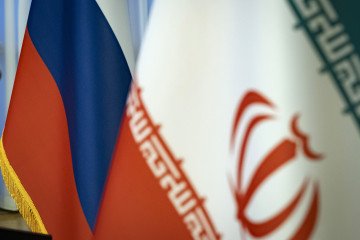 Iranian and Russian flags stand ahead of a joint news conference during a meeting of the two countries’ culture ministers at Vahdat Hall in Tehran, Iran, on June 10, 2025. (Source: Getty Images)