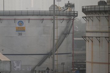 Bharat Petroleum’s storage tankers are seen at sunset in Mumbai on December 8, 2022. (Source: Getty Images)