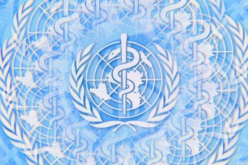 The World Health Organization (WHO) logo is displayed on a computer screen photographed using a kaleidoscopic filter, in Creteil, France, on May 11, 2026 (Source: Getty Images)