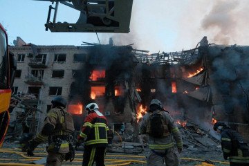 Firefighters work outside a burning residential building in Kyiv following Russia’s mass overnight attack on May 24. (Source: DSNS Kyiv)