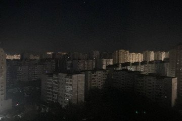 Residential buildings stand largely dark during a widespread power outage in temporarily occupied Crimea on October 24, 2026. (Source: Exilenova+)