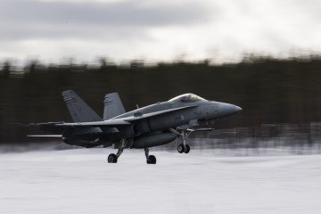 A Finnish F-18 Hornet lands at Jokkmokk Air Base during a joint exercise between the air forces of Finland and Sweden over the Arctic Circle on March 25, 2019. A Finnish F-18 Hornet lands at Jokkmokk Air Base during a joint exercise between the air forces of Finland and Sweden over the Arctic Circle on March 25, 2019.