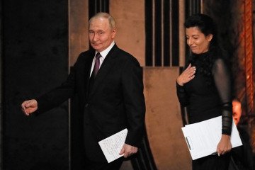 Russian leader Vladimir Putin and RT Editor-in-Chief Margarita Simonyan attend the 20th anniversary celebration of the Russian state TV-station Russia Today at the Bolshoi Theater in Moscow on October 17, 2025. (Source: Getty Images)