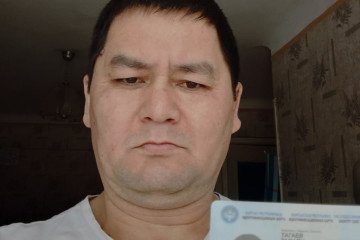 Kyrgyz national Dastan Tagaev holds his identification card. (Source: HUR) Kyrgyz national Dastan Tagaev holds his identification card. (Source: HUR)