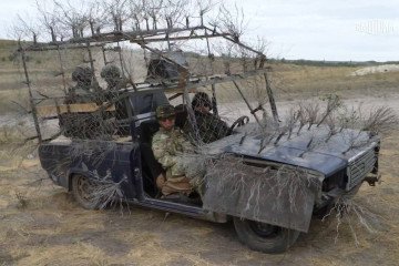Russian soldiers riding a modified Lada near the frontline. (Source: RealJakeBroe/X)
