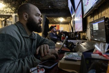 A soldier of the 505th Marine Battalion with the call sign "Frank" looks at a monitor at a command and observation post in the Novopavlivka direction on April 1, 2026, Ukraine. (Source: Getty Images)