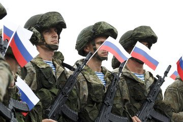 Russian contract soldiers take part in a military ceremony while holding Russian national flags. (Photo: open source) Russian contract soldiers take part in a military ceremony while holding Russian national flags. (Photo: open source)