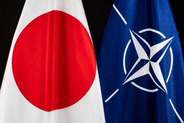 Japanese and NATO flags together. Japanese and NATO flags together.