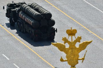 A Russian S-400 Triumph/SA-21 Growler medium-range and long-range surface-to-air missile system drives through Red Square on May 9, 2015.