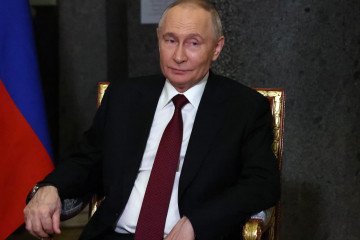 Russian President Vladimir Putin grimases at the hall of the Hemitage Museum, during the Summit of Commonwealth States, on December 22, 2025 in Saint Petersburg, Russia. (Source: Getty Images)