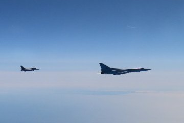 Romanian F-16 fighter jet shadowing a Russian Tu-22M3 long-range bomber over the Baltic, April 22, 2026. (Source: Romanian Defense Ministry)