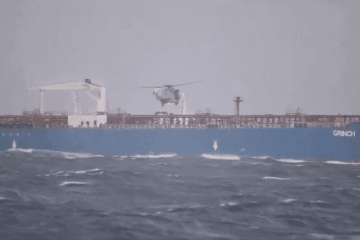 A French naval helicopter hovers over the deck of the shadow fleet tanker Grinch during its seizure in the Mediterranean. (Source: Jean-Noël Barrot / X)