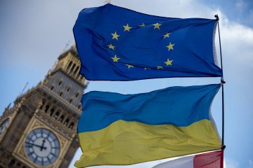 View of the European Union flag and a Ukrainian flag flying in front of the Big Ben during the demonstration at the Parliament Square. (Source: Getty Images)