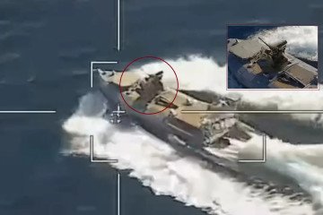 Ukrainian armed sea drone equipped with a remote-controlled machine gun mount, captured in Russian aerial footage near Novorossiysk naval base. (Photo: Open source)