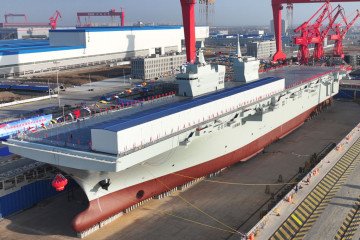 A launching ceremony is held to unveil China’s first Type 076 new-generation amphibious assault ship, the Sichuan, at Hudong-Zhonghua Shipbuilding, in Shanghai, China. (Source: Getty Images)