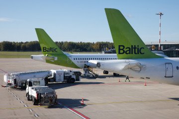A Drone-Proof Airport? Riga Invests $2.59M to Protect Aircraft From Russian Threats An aviation fuel tanker prepares to refuel a passenger jet, operated by Air Baltic Corp., at Riga International Airport, in Riga, Latvia, on October 6, 2024. (Source: Getty Images)