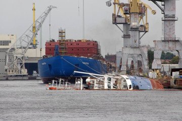 Russian Navy tugboat Kapitan Ushakov sank at a St. Petersburg pier while Yaroslavl Shipyard crews were working on it. (Source: Russian media)