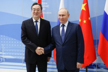 Chinese Vice Premier Ding Xuexiang and Russian leader Vladimir Putin shake hands during a meeting on the sidelines of the Eastern Economic Forum in Vladivostok on September 2, 2026. (Source: Getty Images)