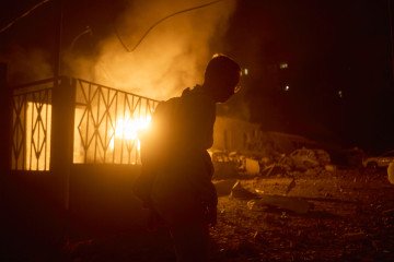 A civilian looking for cover after a Russian ballistic missile strike on Kyiv on August 20, 2026. A civilian looking for cover after a Russian ballistic missile strike on Kyiv on August 20, 2026.