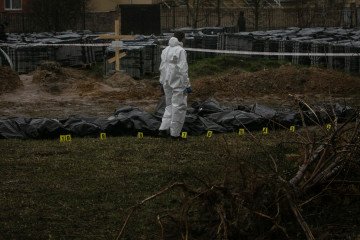 337 Ukrainian POWs Executed as Russia “Turns Torture Into State Policy,” Ombudsman Says Exhumation continues at mass grave of civilians at a construction site near a church in a residential district on April 8, 2022 in Bucha, Ukraine. (Source: Getty Images)