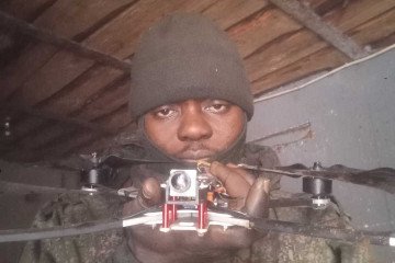 Ayebusiwa Olabode Victor posing with a drone while serving in the Russian Armed Forces. (Source: HUR)