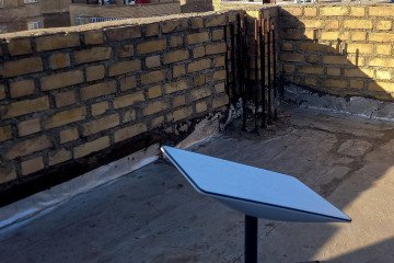 A Starlink receiver sits atop a house in Kurdistan, Iran, January 28, 2023. (Source: Getty Images)