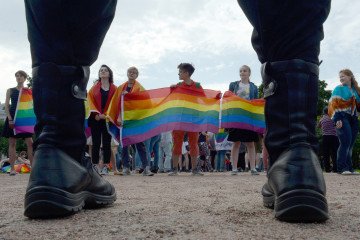 People wave pride movement rainbow flags during the gay pride rally in Saint Petersburg, on August 12, 2017. (Source: Getty Images)
