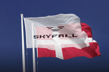 Illustrative graphic of the SkyFall logo displayed prominently alongside the Danish flag, symbolizing the growing partnership between Ukraine's defense industry and Denmark. (Source: UNITED24 Media/Oleksandr Manukians)